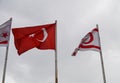 flag of Turkey and Northern Cyprus against the background of a cloudy sky in winter2 Royalty Free Stock Photo