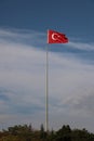 Turkish flag, flag pole, blue sky. Royalty Free Stock Photo