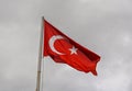 Flag of Turkey rise waving to the wind with sky in the background Royalty Free Stock Photo