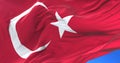 Flag of Turkey waving at wind in slow in blue sky, loop