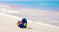 Flag of the Turks and Caicos Islands in the shape of a heart on a sandy beach. Royalty Free Stock Photo