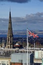 UK flag flying in front of the spire of the Tron Kirk in Edinburgh