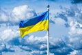 Flag of Ukraine against the background of a cloudy sky