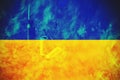 Flag Ukraine against background flames and live ammunition, war and chaos