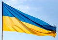 Flag of Ukraine against the blue sky Royalty Free Stock Photo