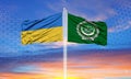 The flag of Ukraine and the Arab League on the flagpole and the blue sky Royalty Free Stock Photo