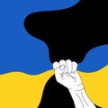 the flag of ukraine clenched in a fist is raised up