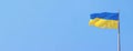 The flag of Ukraine develops against the blue sky Royalty Free Stock Photo