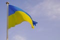 Flag ukrainian National state flag of Ukraine in yellow blue banner on cloudy sky Royalty Free Stock Photo