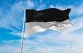 flag of Ulm at cloudy sky background on sunset, panoramic view. Federal Republic of Germany. copy space for wide banner
