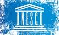 Flag of UNESCO, United Nations Educational, Scientific and Cultural Organization. Wrinkled dirty spots.