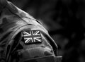 Flag of United Kingdom on military uniform. UK Army. British Armed Forces. Remembrance Day. Poppy day. Empty space for text. Royalty Free Stock Photo