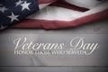 The flag of the United Sates on a grey plank background with copy space Veterans Day tribute Royalty Free Stock Photo