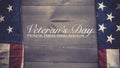 The flag of the United Sates on a grey plank background with copy space Veterans Day tribute Royalty Free Stock Photo