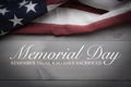 The flag of the United Sates on a grey plank background with memorial day Royalty Free Stock Photo