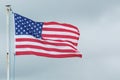 The American flag blows in the wind Royalty Free Stock Photo
