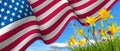 flag of the United States of America waving in the wind and beautiful holiday flowers Royalty Free Stock Photo