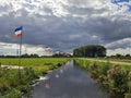 Flag upside down as farmers protest against government measures for nitrogen deposition in Lekkerkerk, the Netherlands