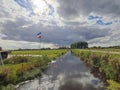 Flag upside down as farmers protest against government measures for nitrogen deposition in Lekkerkerk, the Netherlands