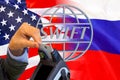 Flag of US and Russia flag and logo SWIFT. Sanctions concept