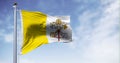 Flag of Vatican City waving in the wind on a clear day Royalty Free Stock Photo