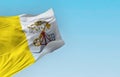 Flag of Vatican City waving in the wind on a clear day Royalty Free Stock Photo