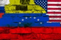 Flag of Venezuela, Russia and the USA on a brick wall background with broken plaster Royalty Free Stock Photo