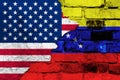 Flag of Venezuela and USA on a brick wall background with broken plaster Royalty Free Stock Photo