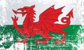 Flag of Wales, United Kingdom. Wrinkled dirty spots. Royalty Free Stock Photo