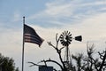 Flag and windmill with a blue and white back drop Royalty Free Stock Photo