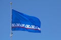 Flag of Yamalo-Nenets Autonomous Okrug waving atop of its pole