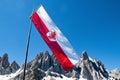 The flagg and the arm of South Tyrol is waving in the wind