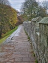 The flagged stone walk way on the York City Walls in Yorkshire, UK. Taken in autumn - winter on an overcast day Royalty Free Stock Photo