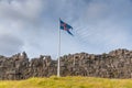 Flagpole with flag of Iceland at former Althingi site at Thingvellir national park