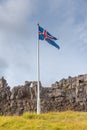 Flagpole with flag of Iceland at former Althingi site at Thingvellir national park