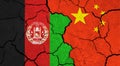 Flags of Afghanistan and China on cracked surface Royalty Free Stock Photo