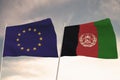 Flags of Afghanistan and EU European Union waving with cloudy blue sky background, 3D rendering
