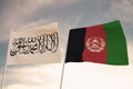 Flags of Afghanistan and Taliban waving with cloudy blue sky background, 3D rendering