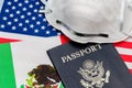 Flags of America and Mexico, passport and N95 respirator face mask