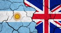 Flags of Argentina and United Kingdom on cracked surface