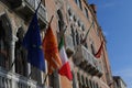 Flags on the background of buildings in Venice, Italy Royalty Free Stock Photo