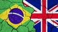 Flags of Brazil and United Kingdom on cracked surface