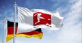 Flags of Bundesliga waving with german flag on a clear day