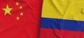 Flags of China and Colombia. Linen flag close-up. Flag made of canvas. Chinese, Beijing. Colombian. State national symbols. 3d