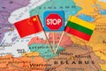 Flags of China and Lithuania on map, concept image to stop conflict between two countries Royalty Free Stock Photo