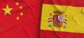 Flags of China and Spain. Linen flag close-up. Flag made of canvas. Chinese flag. Beijing. Spanish. State national symbols. 3d