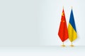 Flags of China and Ukraine on flag stand, meeting between two countries