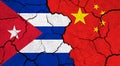 Flags of Cuba and China on cracked surface