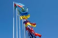 Flags of different countries on the background of the blue sky Royalty Free Stock Photo
