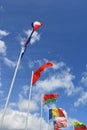 Flags of different countries at blue sky background Royalty Free Stock Photo